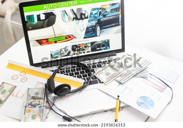 Service staff use laptop check spare parts in\
stock online in service system for maintenance work in service\
center office and check mistake point in the car quality assurance\
document