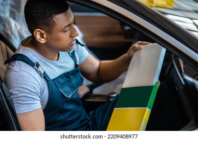 Service Station Worker Repairing The Client Vehicle