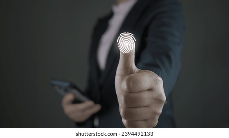 Service users lift their thumbs up and scan their fingers to enter the identity verification system. There is a fingerprint scanning light icon. Security concept for accessing technology systems. - Shutterstock ID 2394492133