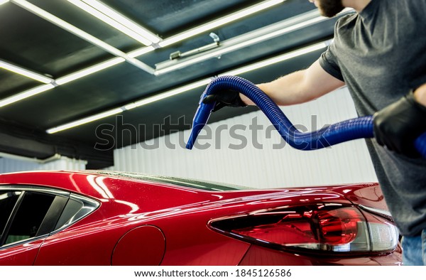 Service worker makes automatic drying of the car
after washing.