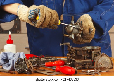 Serviceman Repairing The Old Car Engine Fuel Pump