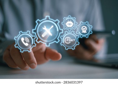 Services concept with engineer using smartphone and laptop computer to monitor customer requests, investigate, and be ready to take action solving problem in customer site.