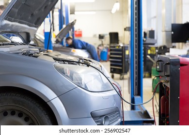 Servicing Car Air Conditioner In Auto Repair Shop