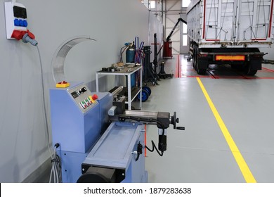 Servicing and repairing trucks in a large garage. Car service and truck maintenance. Auto mechanic checking the truck in the garage. - Powered by Shutterstock