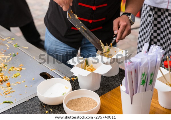 Serving Asian Noodle Stir Fry - Chef\
Dividing Single Serving Portions into Take Out\
Containers