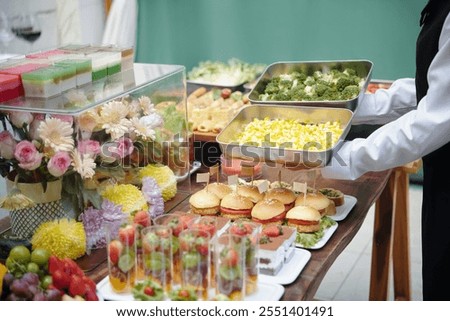 Serving Assorted Buffet Arrangement at Catering Event