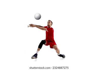 Serving ball. Young concentrated man, professional volleyball player in red uniform in motion against white studio background. Concept of sport, active lifestyle, health, dynamics, game, ad - Powered by Shutterstock