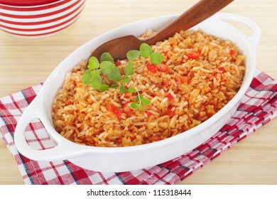 A Serving Bowl Full Of Spanish Rice, A Perfect Accompaniment For Chili. It's Flavoured With Onion, Garlic, Chicken Stock, Tomato And Oregano.