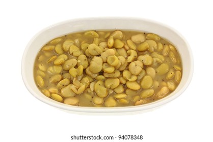 A Serving Dish Of Canned Pale Green Lima Beans.