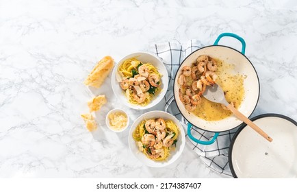 Serving Garlic Shrimp Pasta With Spinach In White Ceramic Bowls.