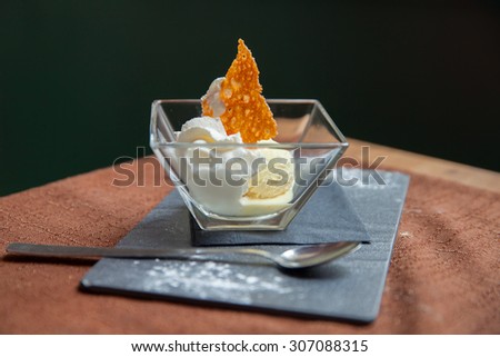 serving ice cream at a cafe table