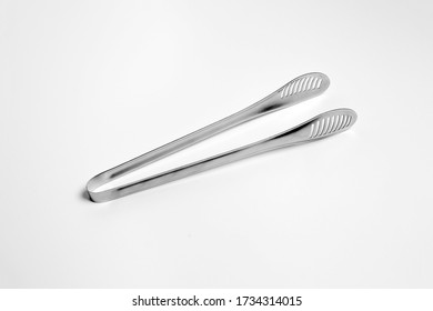 Serving Kitchen Cooking Tongs Isolated On A White Background.High Resolution Photo.