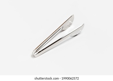 Serving Kitchen Cooking Tongs Isolated On A White Background. High-resolution Photo.