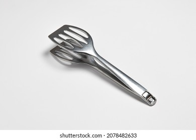 Serving Kitchen Cooking Tongs Isolated On A White Background.High Resolution Photo.Mock Up