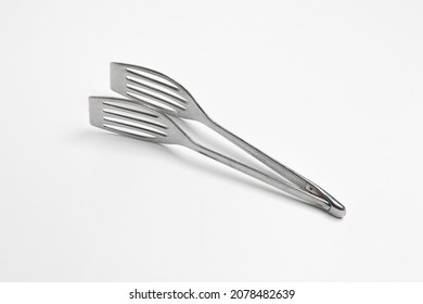 Serving Kitchen Cooking Tongs Isolated On A White Background.High Resolution Photo.Mock Up