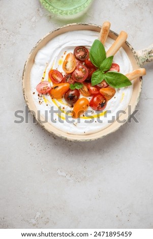 Similar – Tomatencremesuppe in roter Schüssel auf Grunge-Hintergrund