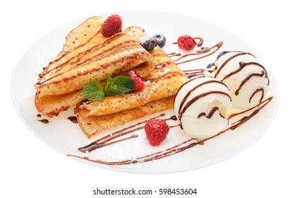 Serving pancakes with ice cream and fresh berries on the plate. Decorated with chocolate syrup.  Isolated on white background. - Powered by Shutterstock