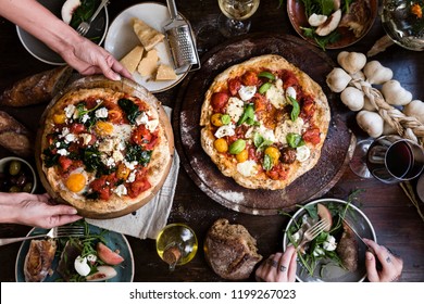 Serving a pizza food photography recipe idea Stock Photo