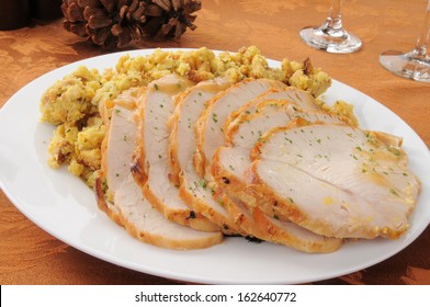 A Serving Platter Of Sliced Turkey And Dressing For Thanksgiving