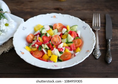  serving of salad from vegetables on old wooden table