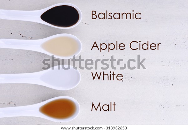 Serving size samples of different types of vinegar\
including Balsamic, Apple Cider, White and Malt vinegars, with text\
names added. 