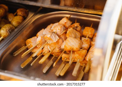 Serving Small Hot Fish Kebabs On The Buffet. Catering For A Dinner Party On The Outdoors. Delivery Of Meals And Banquet Service.