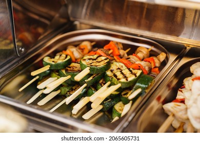 Serving Small Hot Kebabs From Vegetables On The Buffet. Catering For A Dinner Party On The Outdoors. Delivery Of Meals And Banquet Service. Zucchini, Mushrooms And Tomatoes On Skewers