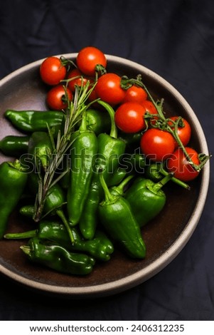 Serving suggestion of fresh, green Galician peppers Pimientos de Padron