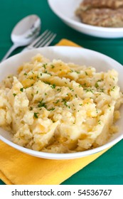 Serving Of Tatties And Neeps With Haggis Behind