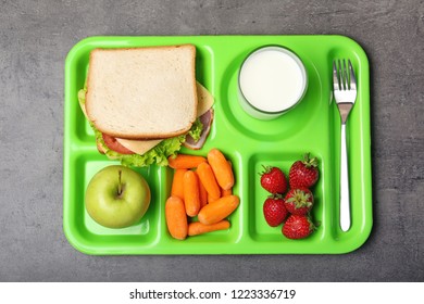 Serving Tray With Healthy Food On Gray Background, Top View. School Lunch