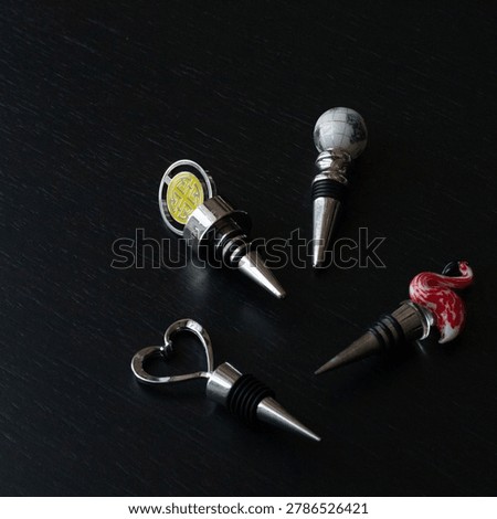 Serving wine properly requires corkscrew stopper, serving accessories on dark background show complete bar toolkit, serving set ideal for home entertaining or restaurant use. 