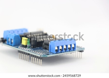 servo driver module shield that enables servo motor and stepper motors to be connected to the micro controller isolated on white background