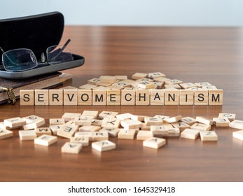 Servomechanism Concept Represented By Wooden Letter Tiles