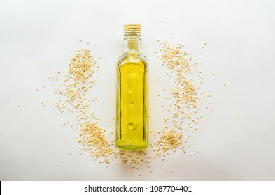 Sesame Oil In Bottle And Sesame Seeds