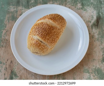 Sesame Seed Bun Isolated On A White Plate