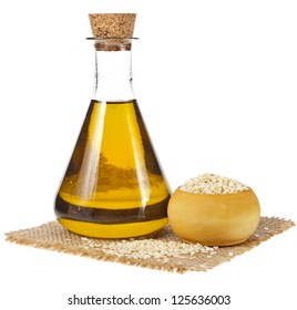 Sesame Seeds And Glass Oil Isolated On White Background