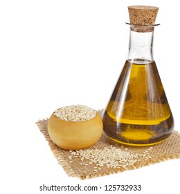 Sesame Seeds And Glass Oil Isolated On White Background