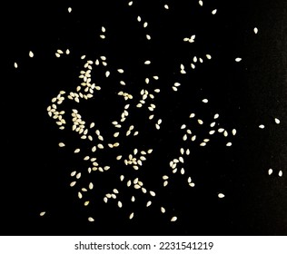 Sesame seeds isolated on black background top view