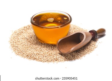 Sesame Seeds Oil And Scoop Isolated On White Background