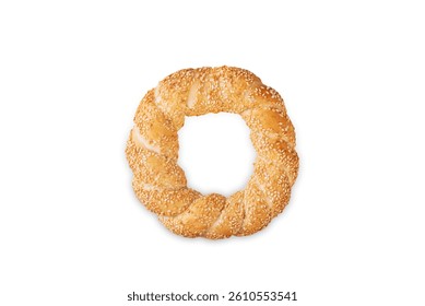 Sesame seeds topping round bagel on a white isolated nackground. toning