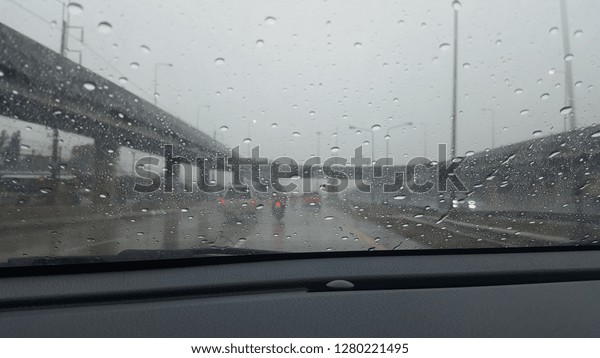 Seson raining in\
car