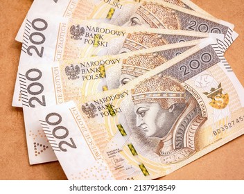 Set of 200 PLN two hundred Polish Zloty bills, banknotes laying spread on the table. Salary, wages in Poland, bonus money, reward, wealth abstract concept, group of objects, business, finance, nobody