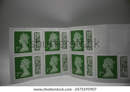 A set of 2nd class postage stamps, plain background 