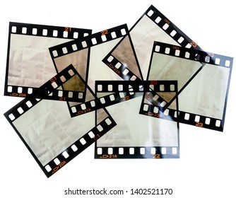 Set of 35mm film strips or snips on white background with empty or blank frames, just blend in your content here to make it look retro or vintage