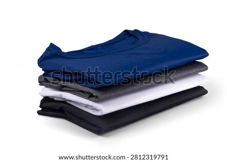 Set of 4 basic sports polyamide t-shirts, stacked and folded, isolated