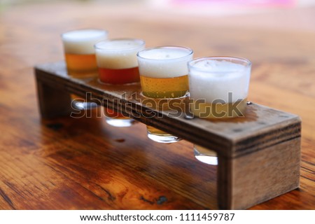 Set of 4 glasses for testing beer. Close-up. Different types of beer.
