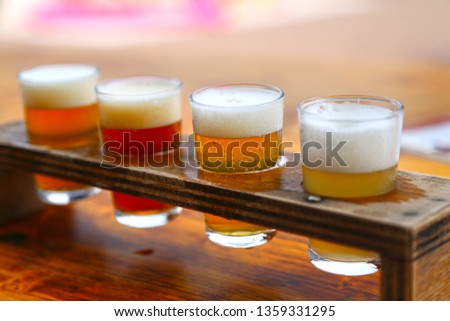 Set of 4 glasses for testing beer. Close-up. Different types of beer.