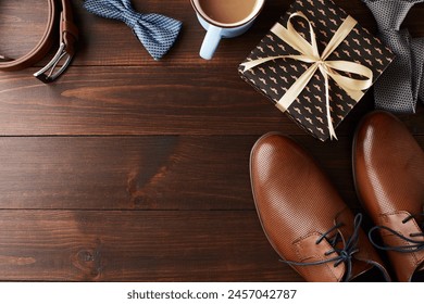 Set against a rustic wooden backdrop, this Father's Day layout features essential men's accessories and a cup of coffee, inviting personalized messages - Powered by Shutterstock