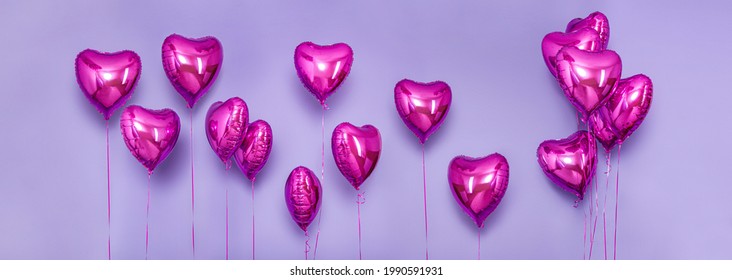 Set of Air Balloons. Bunch of pink color heart shaped foil balloons isolated on purple background. Love. Holiday celebrates. Valentine's Day party decoration. Metallic red Heart air balloons - Powered by Shutterstock