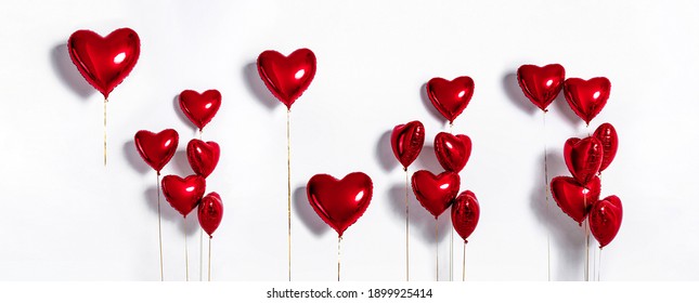 Set of Air Balloons. Bunch of red color heart shaped foil balloons isolated on white background. Love. Holiday celebration. Valentine's Day party decoration. Metallic red colour Heart air ballons - Powered by Shutterstock